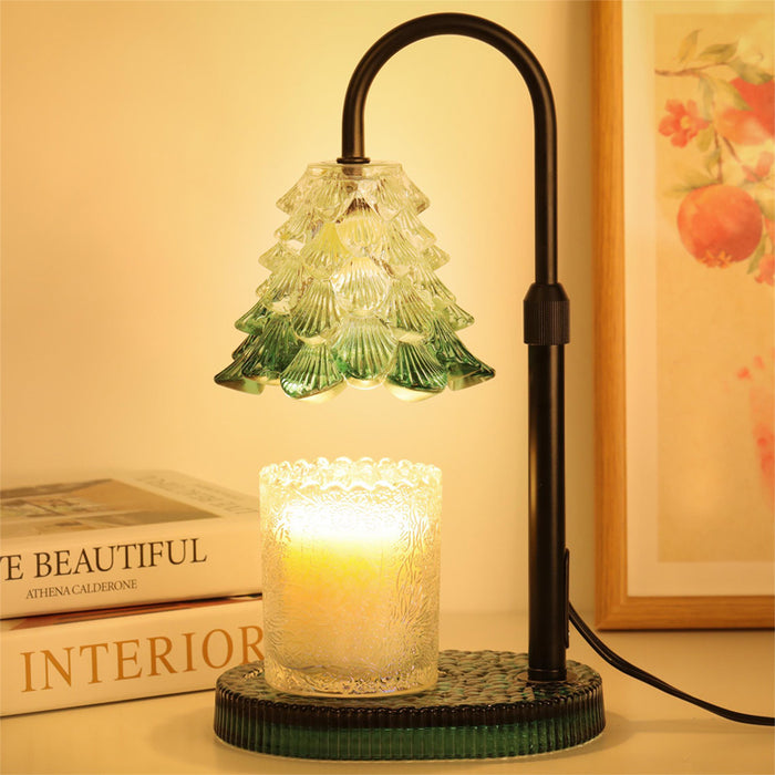 JONJOLI Bloom Candle Warmer lit beside a jar candle