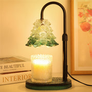 JONJOLI Bloom Candle Warmer lit beside a jar candle